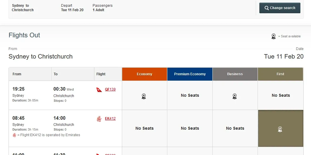 Flight selection page showing Emirates EK412 option for First Class booking